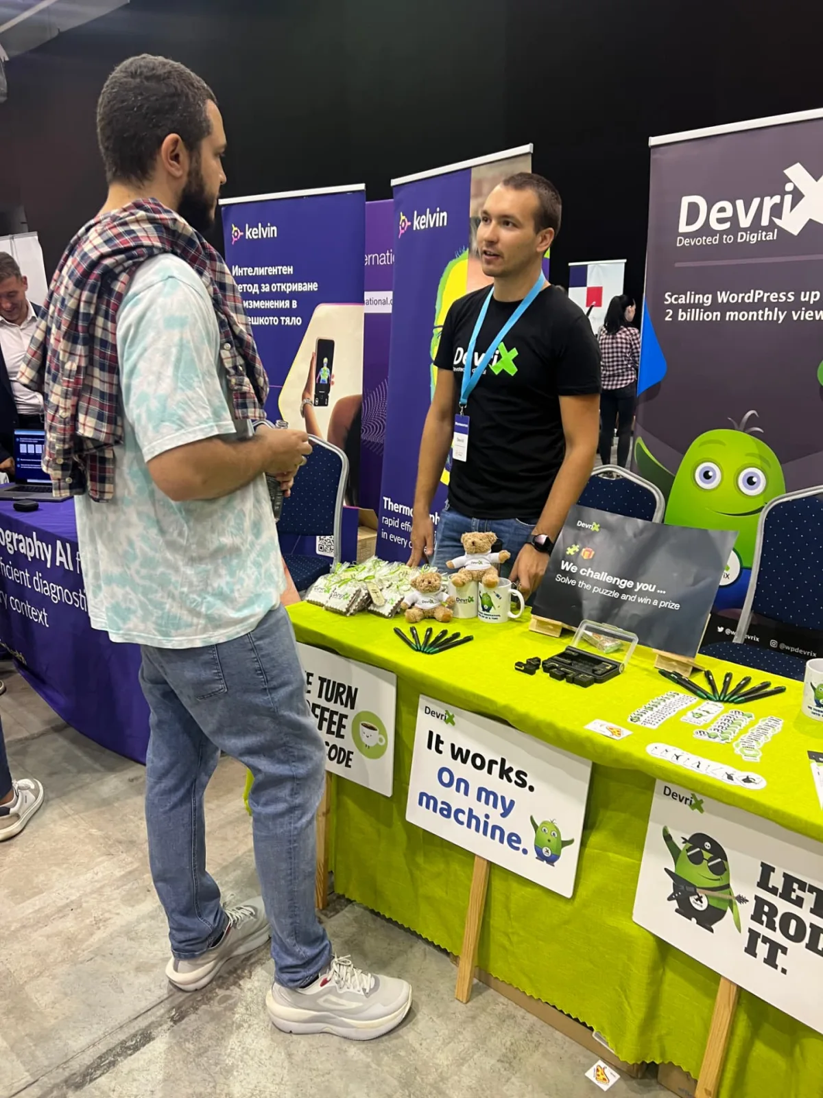 DevriXian chatting with a visitor over the puzzle challenge
